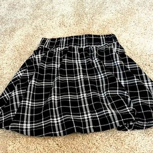 The brand is shein the color is black and white and the size is XS